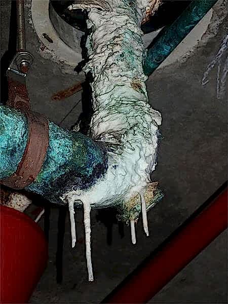 Massive limescale buildup on a water pipe